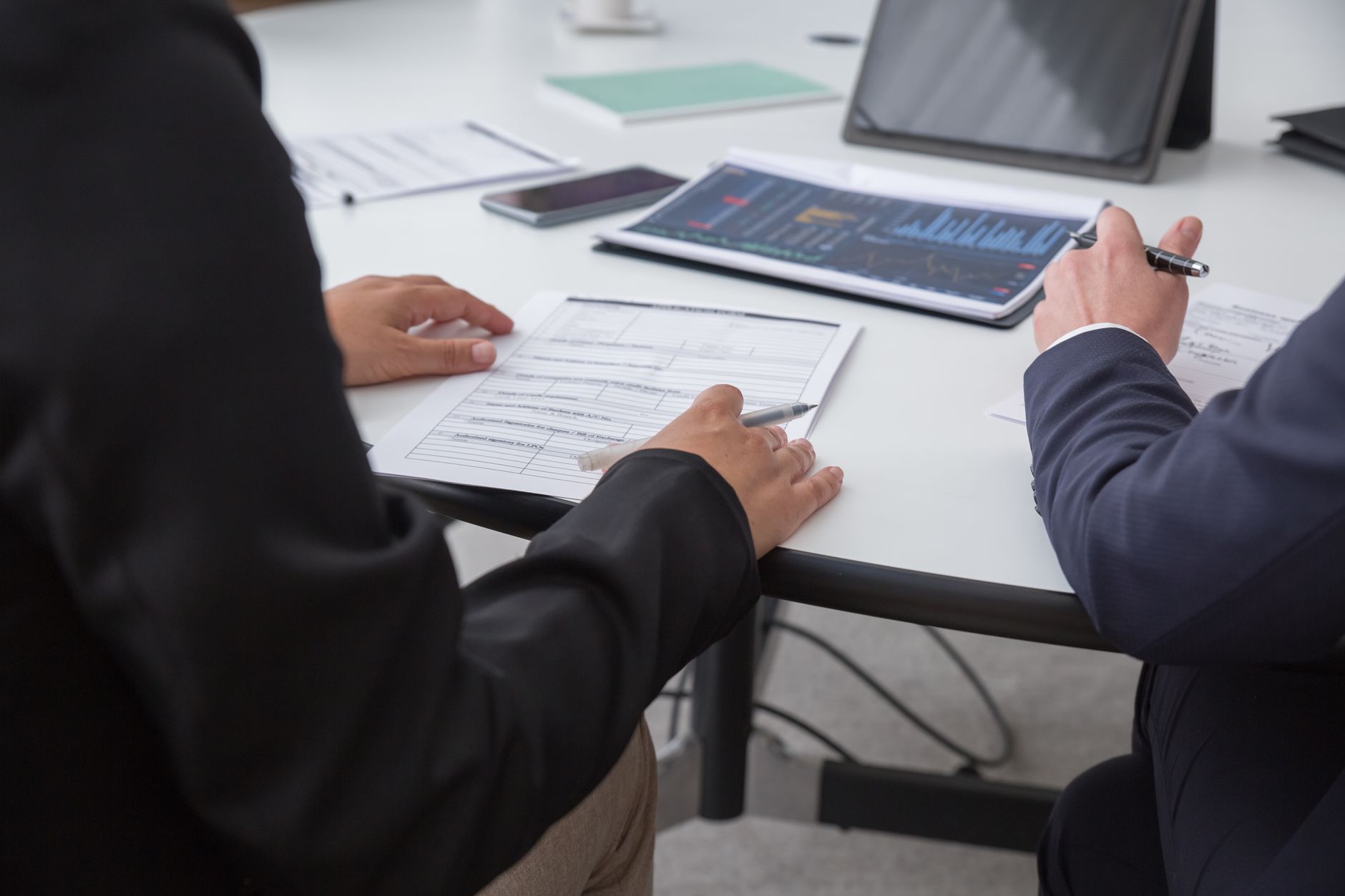 Professionals reviewing analytical documents in a Mexico City office
